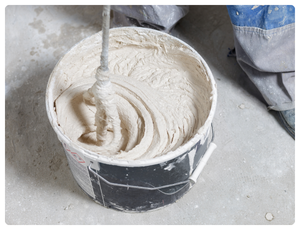 Industrial drums and containers used for construction material storage and transport